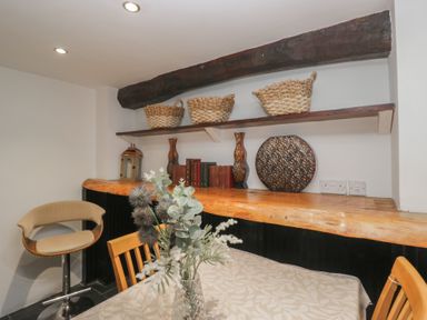 A dining area with a table and chairs at Newlands Fell House near Keswick