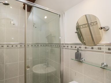 A shower and sink in a bathroom at Newlands Fell House in Newlands near Keswick