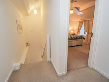 A hallway leading to a bedroom at Newlands Fell House in Newlands near Keswick