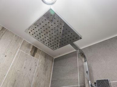 A shower head installed in a bathroom at Newlands Cottage in Keswick
