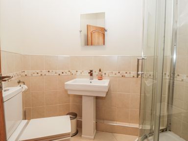 A bathroom with a sink and toilet at Birkbank Farm in Cockermouth