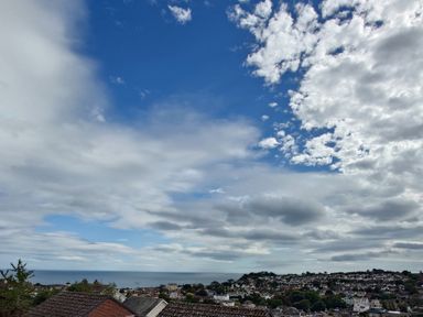 A view of the sky and sea from a hill at Upper Longlands in Dawlish