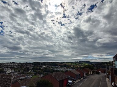 A view of clouds and hills from a parking area at Upper Longlands Dawlish