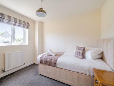 A bedroom with a single bed and window at James Ville Marina Lodge 8 in Brigg