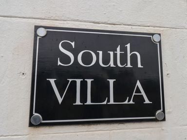 A sign that reads South Villa at South Villa in Sandsend near Whitby
