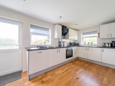 A kitchen with appliances and a window at James Ville Marina Lodge 9 in Brigg