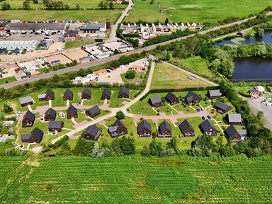 An aerial view of cabins with paths and greenery at James Ville Marina Lodge 14 in Brigg