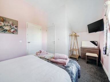 A bedroom with a bed and furniture at James Ville Marina Lodge 23 in Brigg