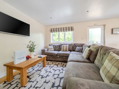 A living room with a sofa and coffee table at James Ville Marina Lodge 10, Brigg
