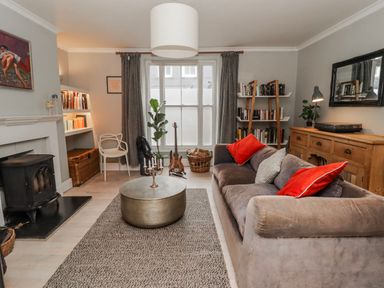 A living room with a sofa and coffee table at The Secret Garden in Narberth