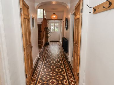 A hallway with a staircase at The Secret Garden in Narberth