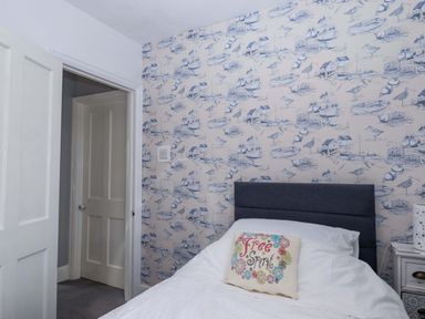 A bedroom with a bed and pillow at 16 Elmbank Gardens Paignton