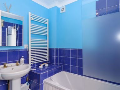 A bathroom with a sink and bathtub at 16 Elmbank Gardens in Paignton