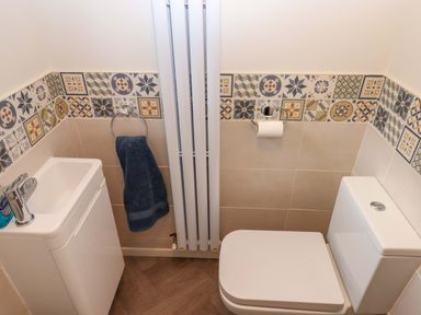 A bathroom with a sink and toilet at 16 Elmbank Gardens in Paignton