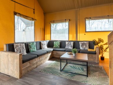 A living room with a sofa and coffee table at Kruger (Pet) in Penrith