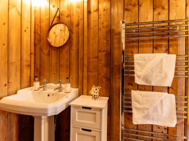 A bathroom with a sink and towel rack at Kruger (Pet) in Penrith