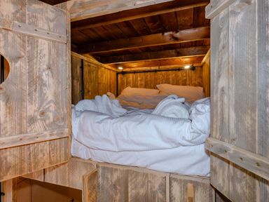 A wooden bunk bed with blankets in Kruger (Pet) Penrith
