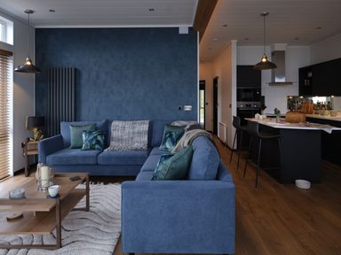 A living room with a sofa and coffee table at Wilde Spa in Carmarthen