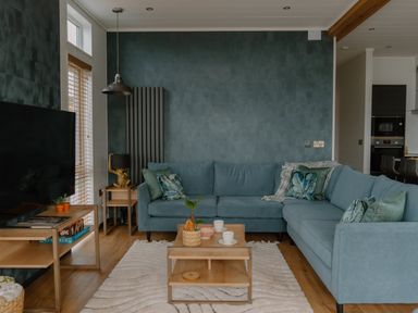 A living room with a sofa and coffee table at Wilde Spa in Carmarthen