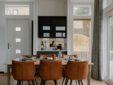 A dining room with a table and chairs at Wilde Spa (Pet) in Carmarthen