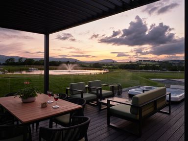 An outdoor area with seating and a hot tub at Wansfell (Pet) Penrith