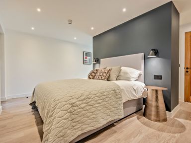 A bedroom with a bed and bedside table at Arvor Studio 1.0 in Bude