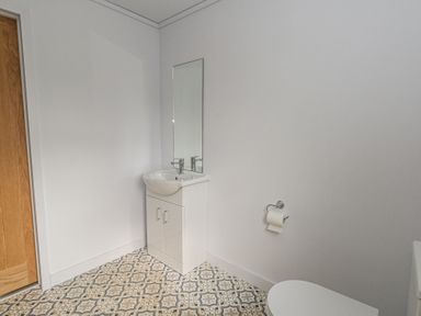 A bathroom with a sink and toilet at Grass Roots