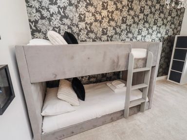 A bunk bed with pillows and sheets at The Joiners Cottage in Birling near Warkworth
