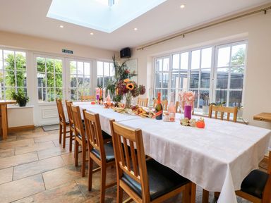 A dining room with a table and chairs at Oldfields in Bury St Edmunds