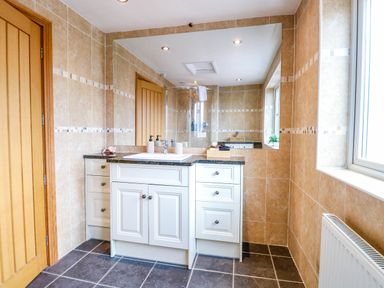 A bathroom with a vanity unit and sink at Oldfields Bury St Edmunds