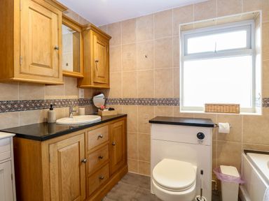 A bathroom with a sink and toilet at Oldfields in Bury St Edmunds