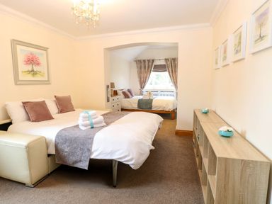 A bedroom with two beds and furniture at Oldfields in Bury St Edmunds
