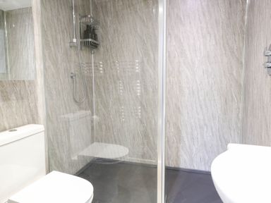 A bathroom with a shower and toilet at Oldfields in Bury St Edmunds