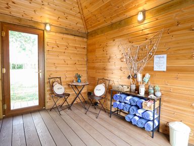 A snug with seating and towels at Oldfields in Bury St Edmunds