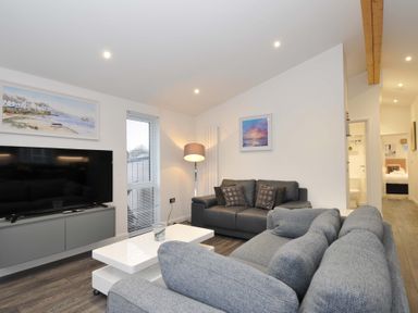 A living room with a sofa and television at 20 Meadow Retreat in Dobwalls