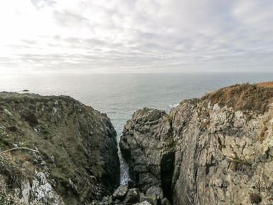 A coastal view with cliffs and ocean at Willow's Way in Stranraer