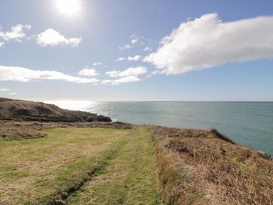 A grassy path leading to the sea at Willow's Way in Stranraer