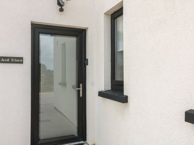 An entryway with a door and window at Ard Uisce @ Estuary Bliss Duncannon, County Wexford