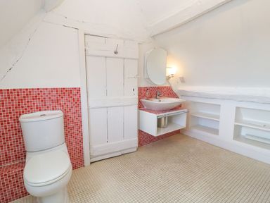 A bathroom with a sink and toilet at The Smithy in Stow on the wold