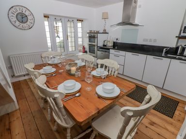 A dining area with a table and chairs at Rock House in Narberth
