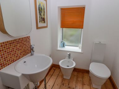 A bathroom with a sink, toilet, and bidet at Rock House in Narberth