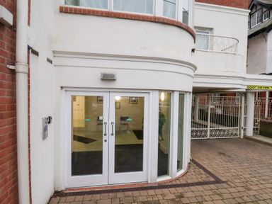 An entrance with glass doors and a car park area at One Union Mill - garden apartment Whitby