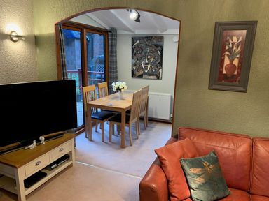 A dining room with a table and chairs at The Hermitage in Penrith