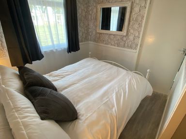 A bedroom with a bed and pillows at Chalet 58 in California, Norfolk