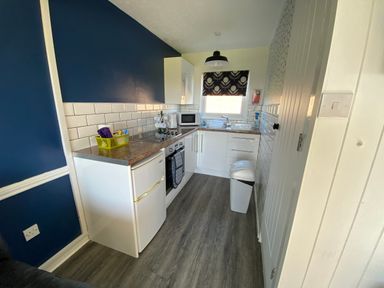 A kitchen with appliances and countertop at Chalet 333 California, Norfolk
