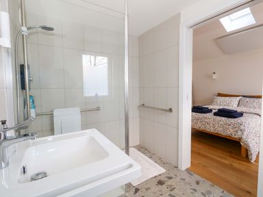 A bathroom with a shower and sink at The Pebble in Dorchester