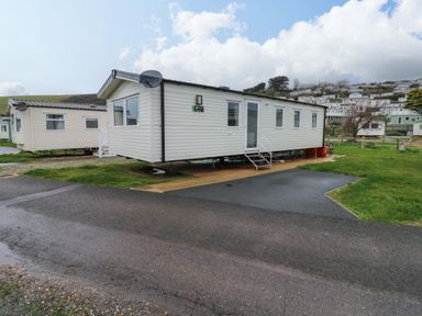 A mobile home with steps on a patio at Valley 36 in Kingsbridge