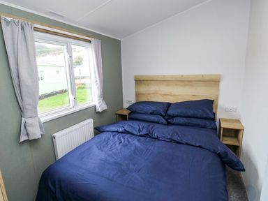 A bedroom with a bed and window at Valley 36 in Kingsbridge