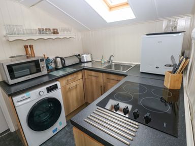 A kitchen with appliances and fixtures at Beacon House Marloes near Little Haven