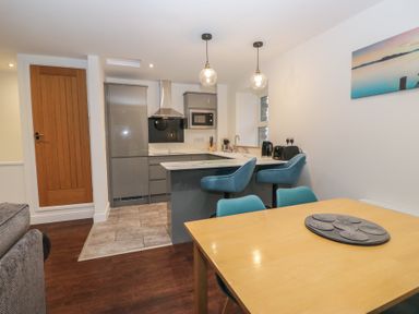 A kitchen with a dining area at 6 Hallin Fell in Penrith